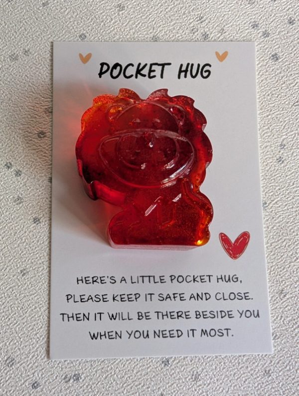 Red resin lion pocket hug